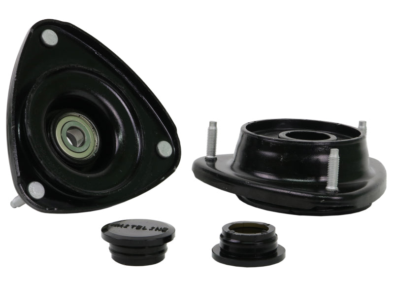 Subaru WRX strut mounts from Whiteline featuring offset assembly for improved caster and camber adjustments.