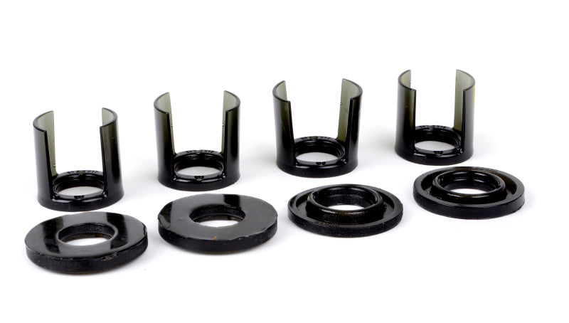 Subaru WRX rear subframe mount insert kit components including bushings and washers in black color.