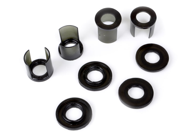 Subaru WRX rear subframe mount insert kit components including various bushings and inserts.