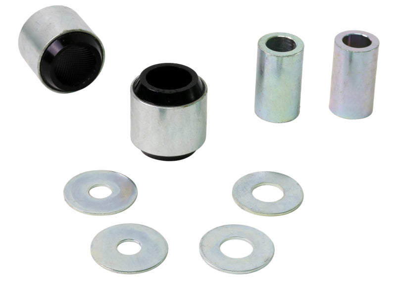 Subaru WRX rear trailing arm bushing kit components including bushings and washers for improved suspension performance.