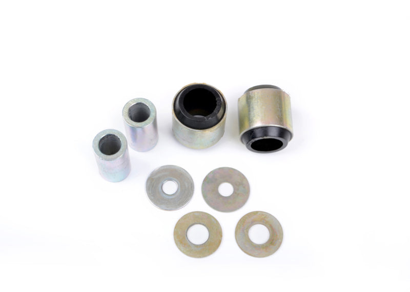 Subaru WRX rear trailing arm bushing kit components including bushings and washers.