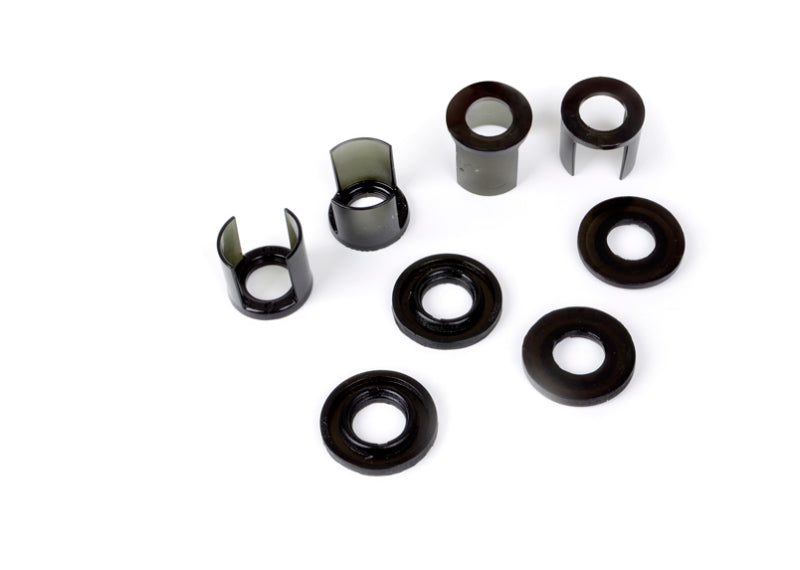 Subaru WRX rear subframe mount insert kit components including various bushings and inserts.