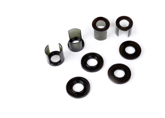 Subaru WRX rear subframe mount insert kit components including various bushings and inserts.