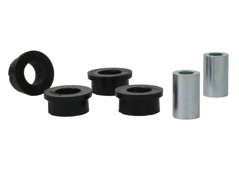 Subaru WRX STI rear toe arm bushing kit components including synthetic elastomer bushings and metal sleeves.